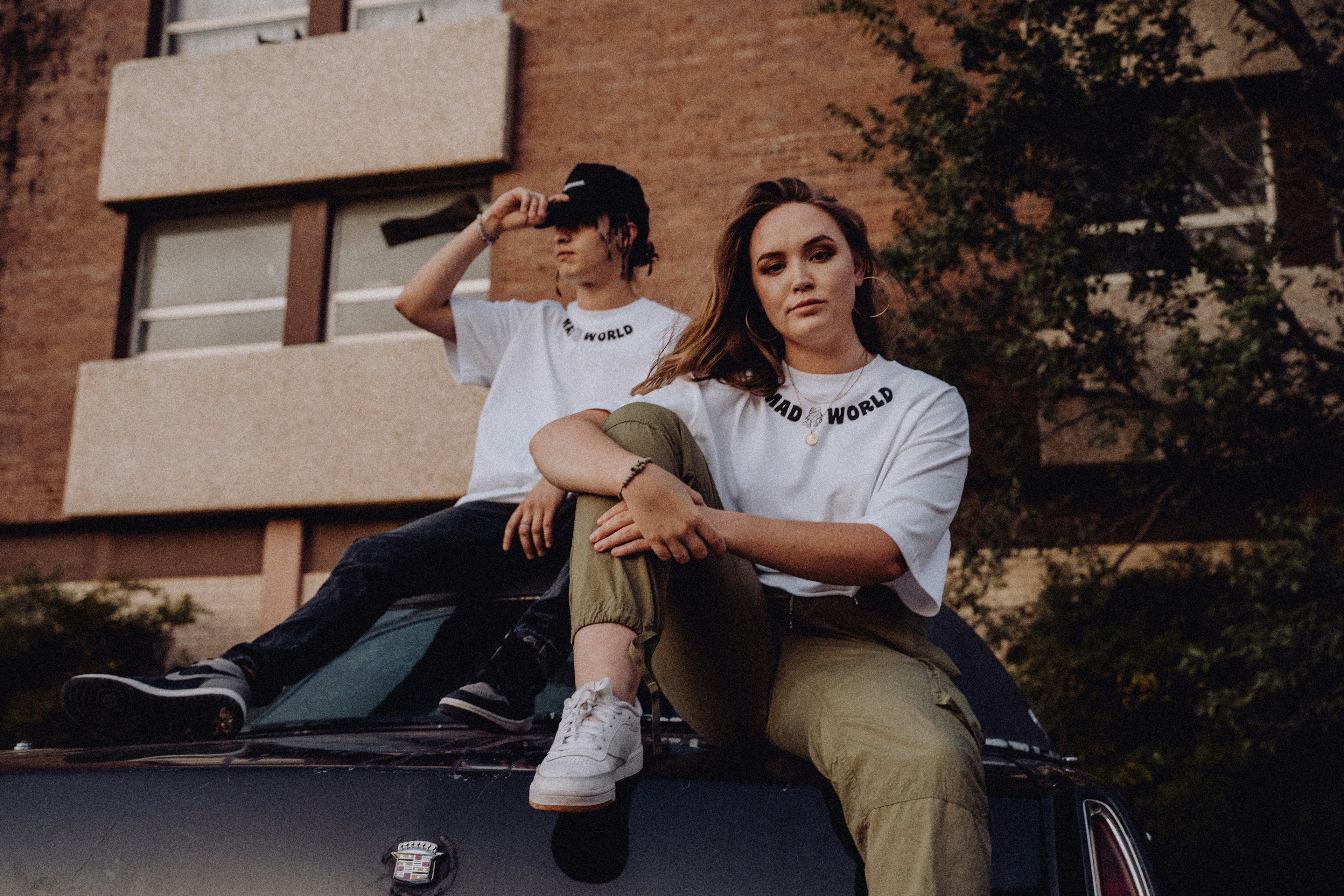 Two models wearing Thread Trends streetwear – sustainable fashion collection
